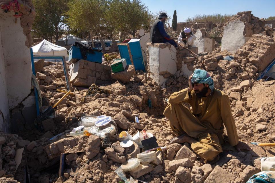 An Afghan man sits amid the rubble after a massive 6.3 magnitude earthquake strikes the city of Herat (Middle East Images/AFP/Getty)