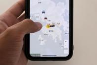 The HKmap.live App is pictured on a phone screen in this photo illustration in Hong Kong