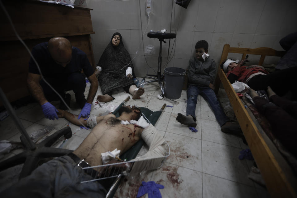 Palestinians wounded in the Israeli bombardment of the Gaza Strip arrive at a hospital in Khan Younis on Friday, Dec. 8, 2023. (AP Photo/Mohammed Dahman)