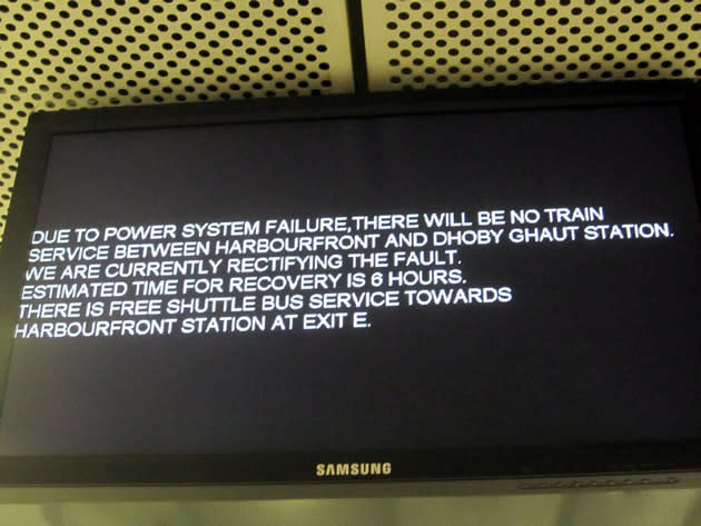 This message was displayed on North East Line screens at Dhoby Ghaut station. (Yahoo! photo/Jeanette Tan)