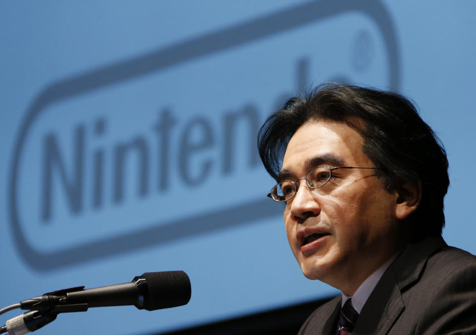 FILE - In this Jan. 31, 2013, file photo, then Nintendo Co. President Satoru Iwata speaks during a news conference in Tokyo. Nintendo's late president Iwata oversaw the video-game maker's global growth, helping make Super Mario and Pokemon household names. “Ask Iwata" was published after his death from cancer in 2015 at 55 and an English translation of the book is being published in April, 2021, by VIZ Media. (AP Photo/Koji Sasahara, File)
