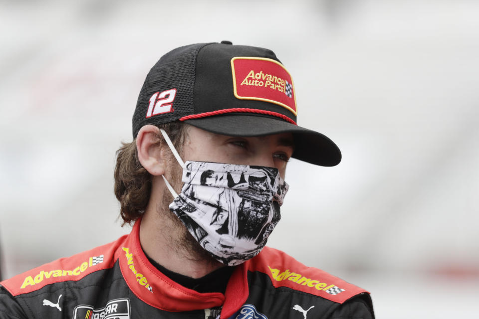 FILE - This June 7, 2020, file photo shows Ryan Blaney waiting in pit row before a NASCAR Cup Series auto race at Atlanta Motor Speedway in Hampton, Ga. With a bit of disbelief over his fast fall in NASCAR's standings, Ryan Blaney is determined to avoid elimination from the playoffs. (AP Photo/Brynn Anderson, File)