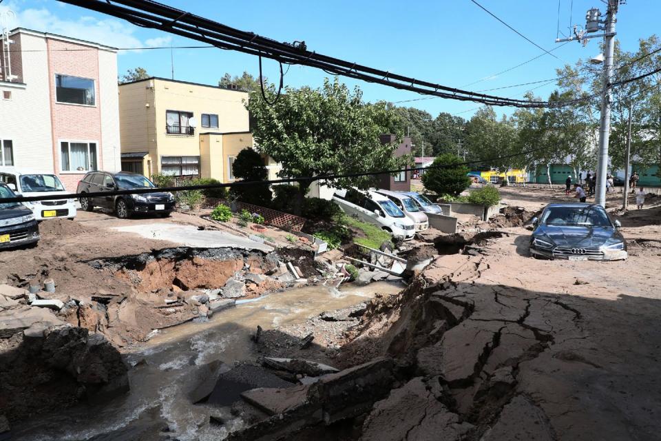 <p>Cars are stuck on a road damaged by the earthquake in Sapporo.</p>