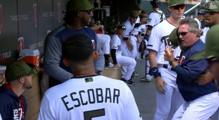 Twins pitching coach Neil Allen jumps back after Miguel Sano pranks him with a rubber rattlesnake. (MLB.com)