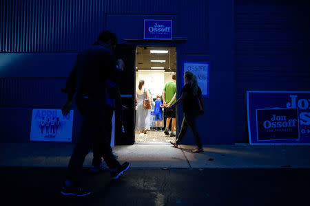 Supporters arrive at an election eve rally at Andretti Indoor Karting and Games in Roswell, Georgia. The rally is for Democratic candidate Jon Ossoff for Georgia's 6th Congressional District. There is a special election tomorrow to fill that seat, which opened after Republican Tom Price was appointed as secretary of Health and Human Services. REUTERS/Kevin D. Liles