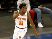 New York Knicks' Frank Ntilikina celebrates his 3-point shot in the second quarter against the Indiana Pacers during an NBA basketball game Saturday, Feb. 27, 2021, in New York. (Elsa/Pool Photo via AP)