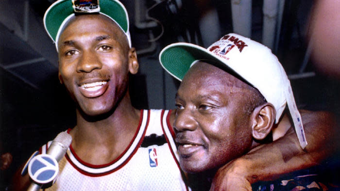 Michael Jordan wraps his arm around his father after winning the 1992 NBA championship. (Reuters)