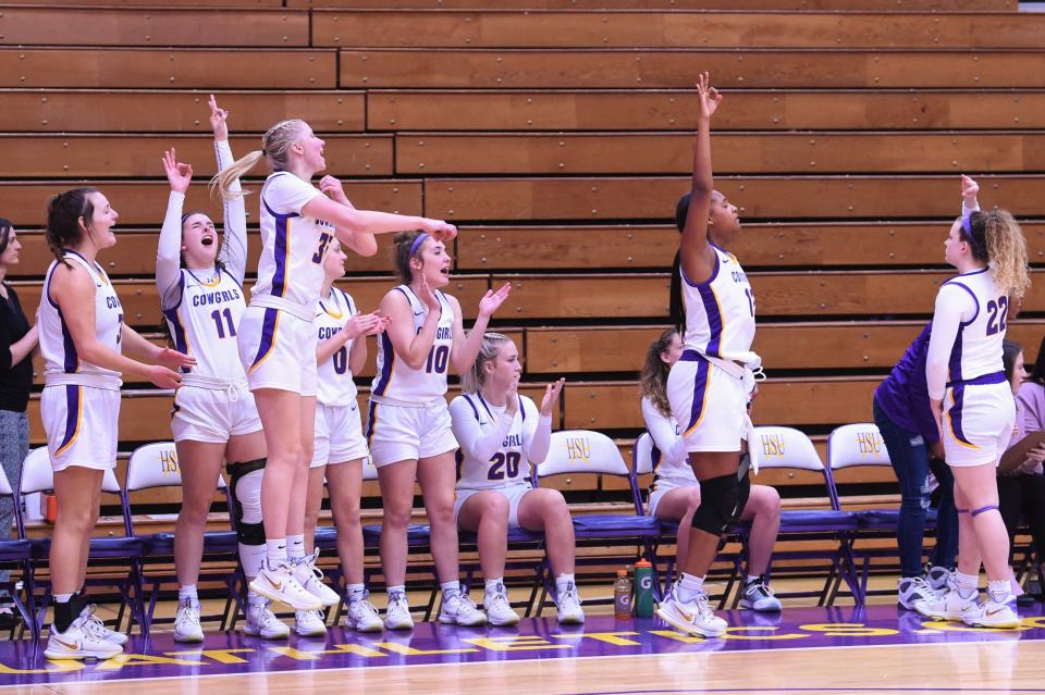 The Hardin-Simmons bench celebrates a made 3-pointer during Saturday's ASC game against McMurry. The No. 21 Cowgirls made 14 shots from beyond the arc in the 88-69 victory.