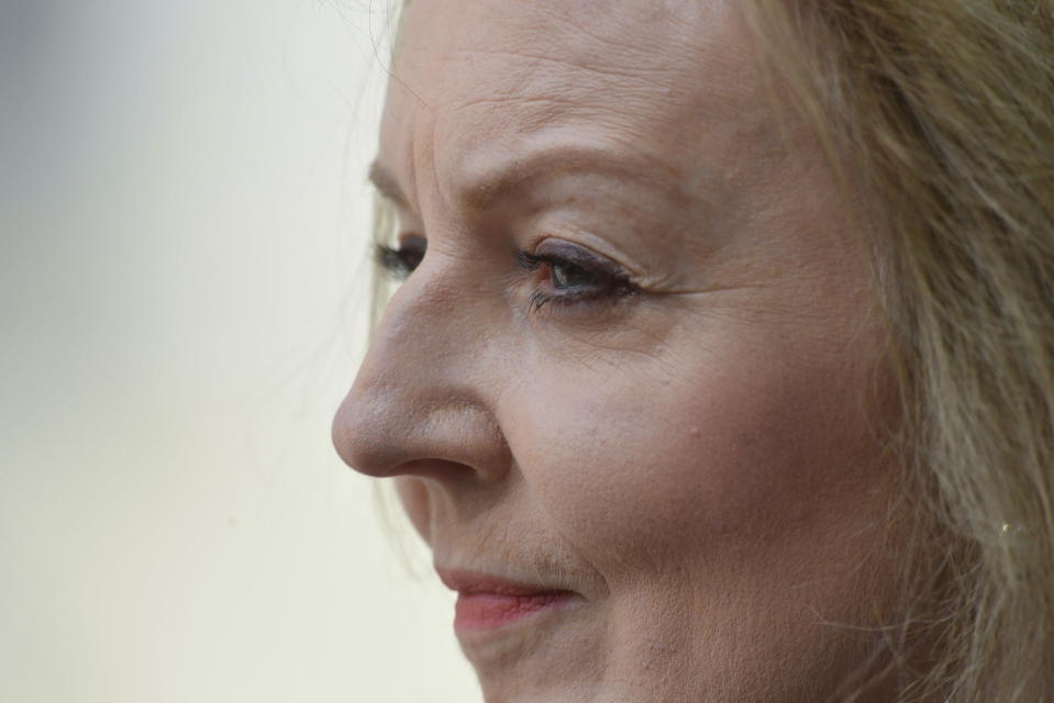 FILE - Britain's Foreign Secretary Liz Truss attends the Wreath Laying Ceremony commemorating ANZAC Day at the Cenotaph, London, Monday, April 25, 2022. Britain's new leader, Liz Truss, is the child of left-wing parents who grew up to be an admirer of Conservative Prime Minister Margaret Thatcher. Now she is taking the helm as prime minister herself, with a Thatcherite zeal to transform the U.K. One colleague who has known Truss since university says she is “a radical” who wants to “roll back the intervention of the state” in people’s lives, just as Thatcher once did. (Toby Melville/Pool Photo via AP, File)