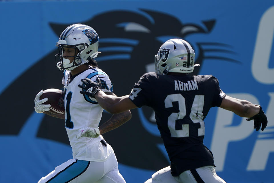 Carolina Panthers wide receiver Robby Anderson, left, scores past Las Vegas Raiders safety Johnathan Abram during the second half of an NFL football game Sunday, Sept. 13, 2020, in Charlotte, N.C. (AP Photo/Brian Blanco)