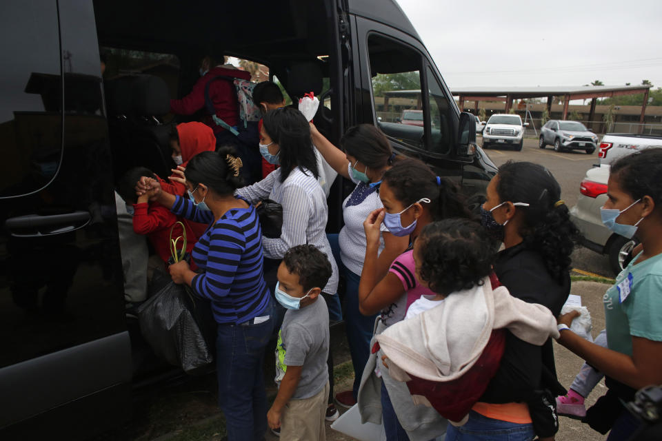Migrants board a van at Our Lady of Guadalupe Catholic Church in McAllen, Texas, on Palm Sunday, March 28, 2021. U.S. authorities are releasing migrant families at the border without notices to appear in immigration court and sometimes, without any paperwork at all. (AP Photo/Dario Lopez-Mills)