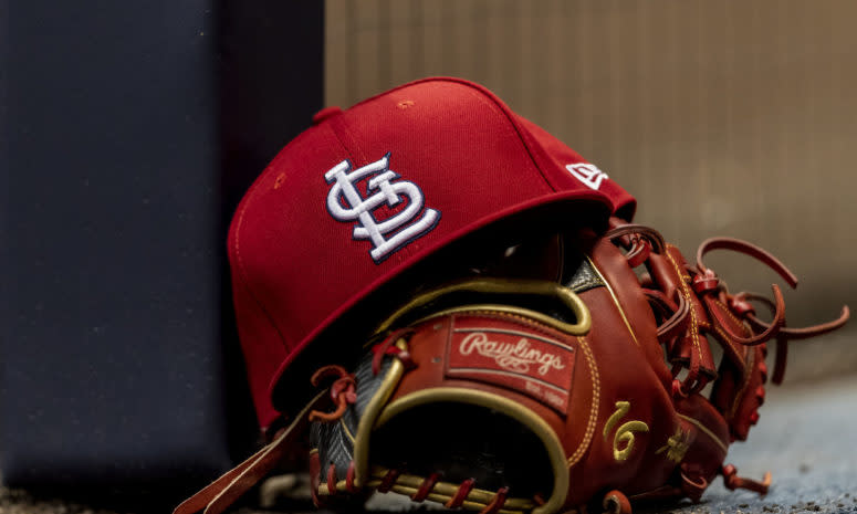 St. Louis Cardinals hat with a glove.