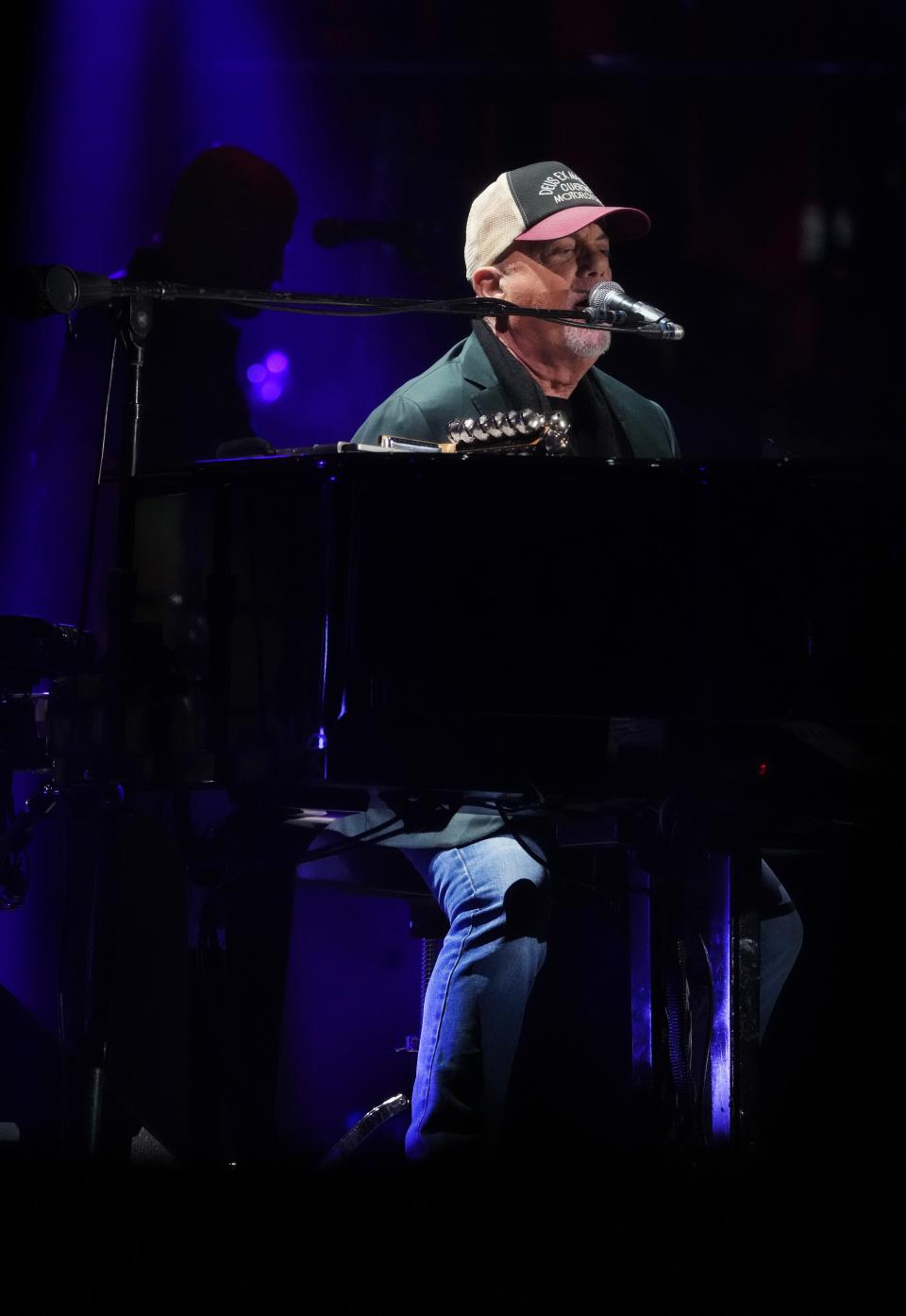 Billy Joel performs with his band at Chase Field on Dec. 8, 2023.