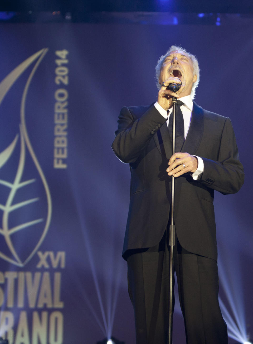 Welsh crooner Tom Jones performs during a gala dinner marking the end of the 16th annual Cigar Festival in Havana, Cuba, Friday, Feb. 28, 2014. The festival is a five-day bash that brings together hundreds of cigar sophisticates from around the world, and culminates with a gala and auction of humidors worth hundreds of thousands of dollars. Tom Jones was among the celebrity invitees at Saturday's auction and sang three songs for attending guests, including his signature "It's Not Unusual." (AP Photo/Franklin Reyes)