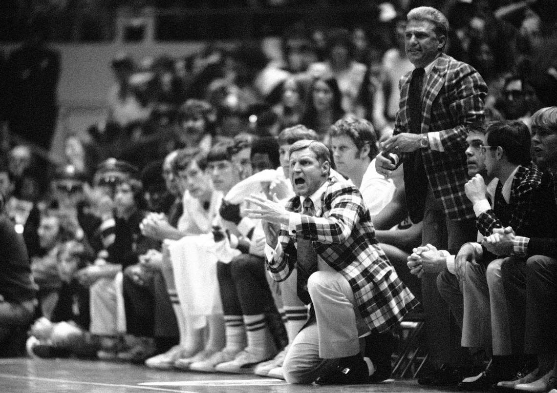 North Carolina State basketball coach Norm Sloan displays his emotions on the bench during their double overtime 80-77 victory over UCLA in the NCAA semifinals in Greensboro, N.C., March 25, 1974.