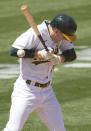 Oakland Athletics' Mark Canha (20) is hit by a pitch by Detroit Tigers pitcher Casey Mize during the fifth inning of a baseball game on Saturday, April 17, 2021, in Oakland, Calif. (AP Photo/Tony Avelar)