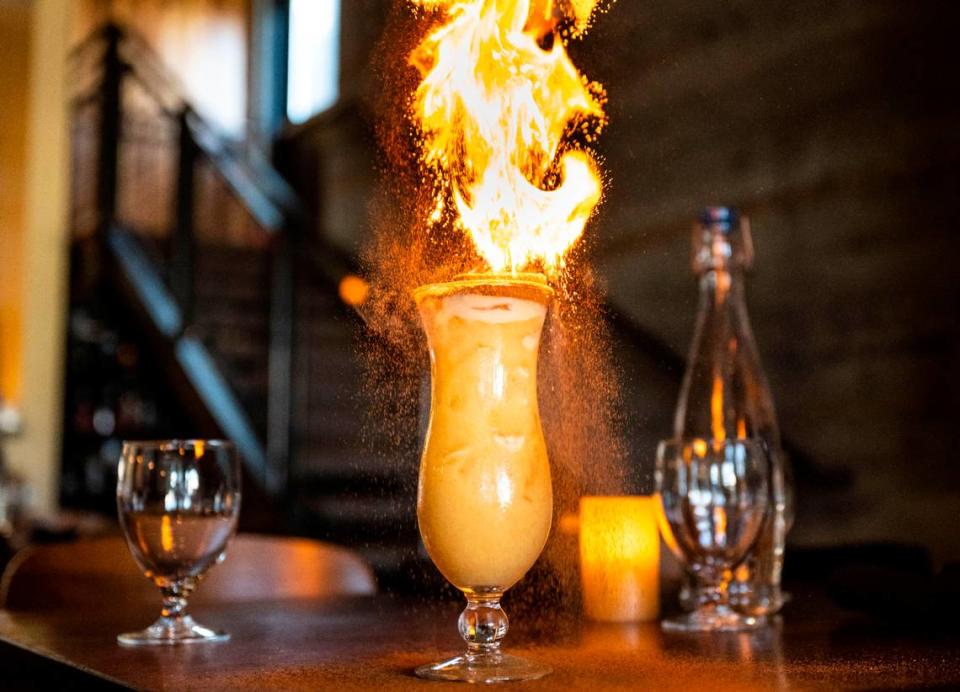 Cuerno Bravo’s painkiller combines navy-strength rum with orange and pineapple juice, coconut cream and a frozen lime that is lit on fire and dowsed with cinnamon powder, which causes it to spark.