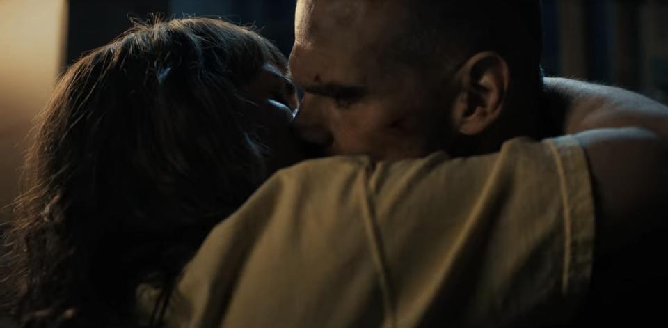 Hopper and Joyce kissing in "Stranger Things"
