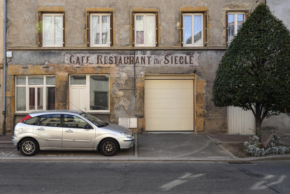 A closed cafe named "Cafe du Siecle" is seen in Pontcharra-sur-Turdine, central France, Monday, Sept. 16, 2019. A mass die-off of France's bars, from 200,000 in 1960 to 36,000 now, fed into the sense of isolation and abandonment that was a driving force behind the so-called "yellow vest" protest movement that rocked France this year. (AP Photo/Laurent Cipriani)