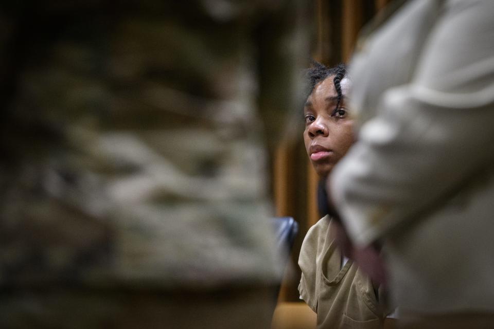 Sgt. Tiara Vinson listens as Spc. Kelia Horton’s cousin, Lohnai Lenhardt, speaks in court during a plea hearing at the Cumberland County Courthouse on Wednesday, Aug. 30, 2023. Vinson pleaded guilty to second-degree murder and discharging a weapon into an occupied vehicle in the May 7, 2021, death of Horton.