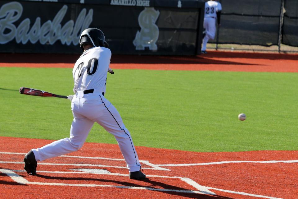 Amarillo High's Max Milligan (20) takes a pitch against the Plainview Bulldogs during a District 3-5A contest March 30 at Sandie Field. [Michael C. Johnson/for Amarillo Globe-News]