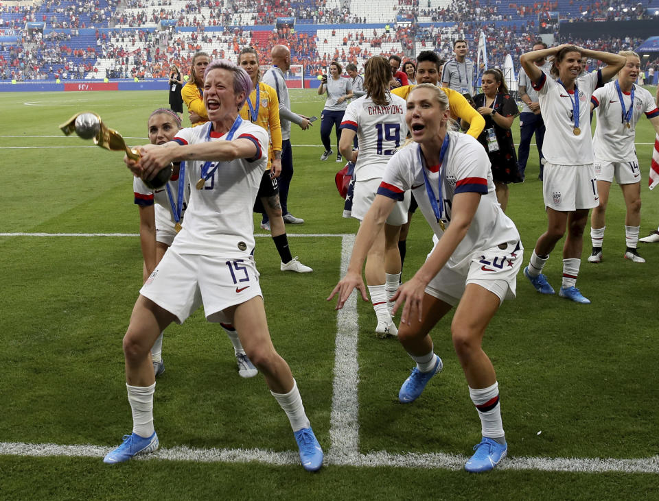 United States' Megan Rapinoe , left, celebrates with teammates their victory in the Women's World Cup final soccer match between US and The Netherlands at the Stade de Lyon in Decines, outside Lyon, France, Sunday, July 7, 2019. US won 2:0. (AP Photo/David Vincent)