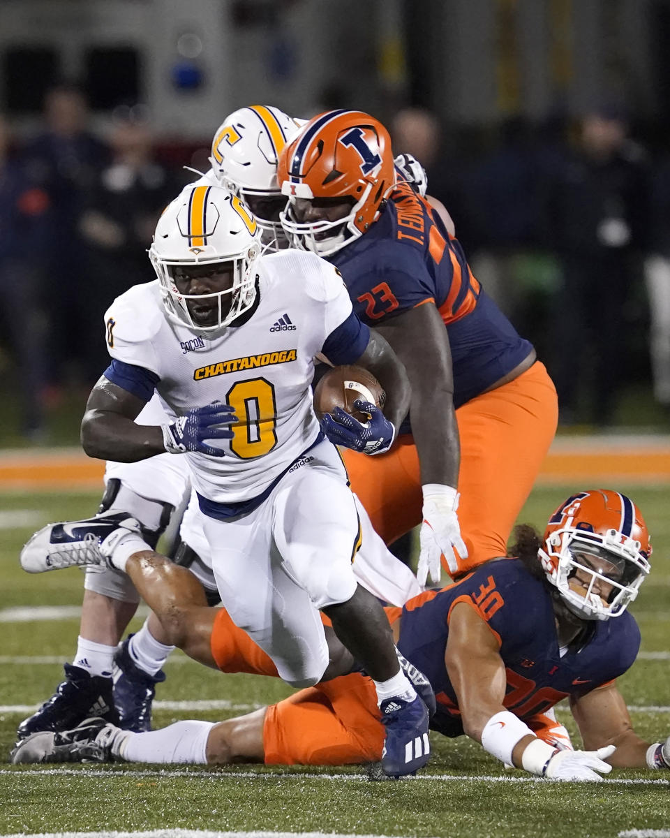 Chattanooga running back Ailym Ford breaks into the open during the first half of the team's NCAA college football game against Illinois on Thursday, Sept. 22, 2022, in Champaign, Ill. (AP Photo/Charles Rex Arbogast)