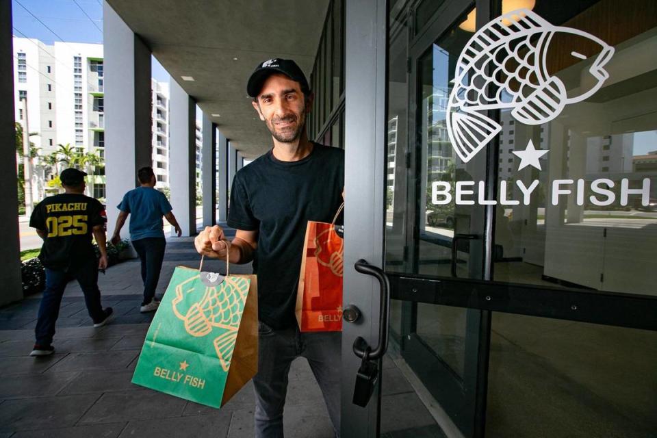 Belly Fish co-founder Jonathan Perlman steps outside the newly opened sushi restaurant at the CORE Link apartments at the Douglas Road Metrorail Station, the hub of a busy new urban neighborhood.