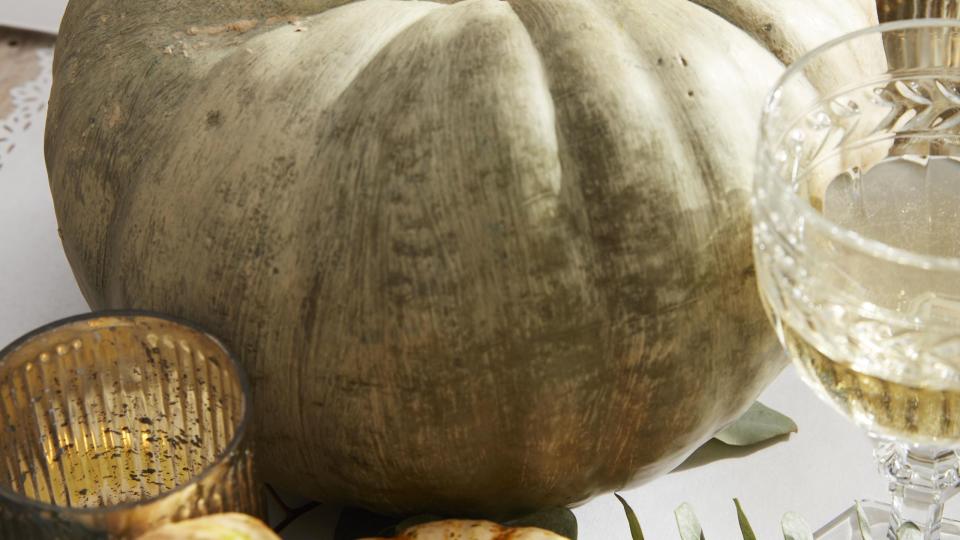 whitewashed green pumpkins on a thanksgiving table