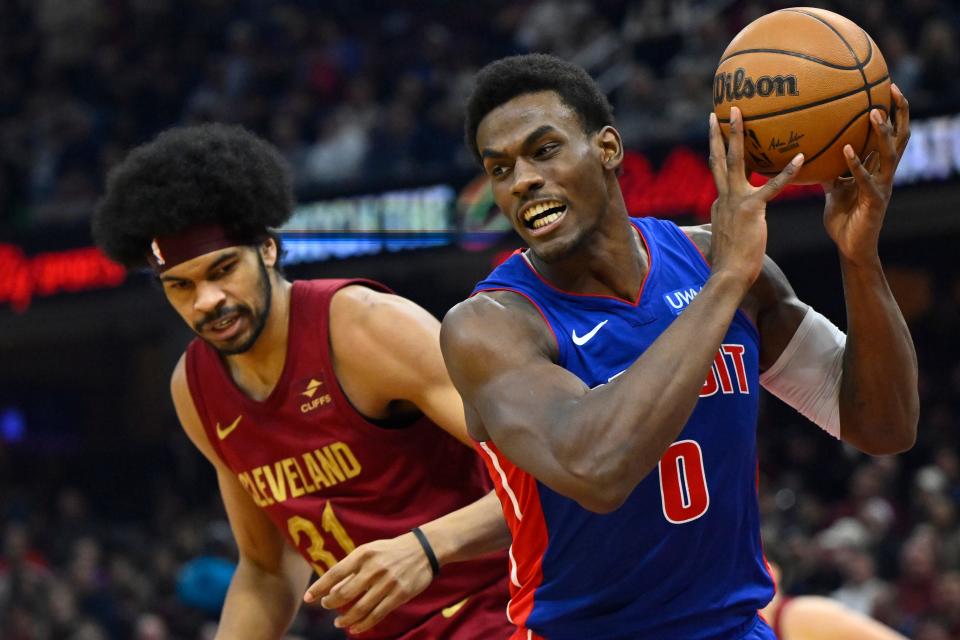 Pistons center Jalen Duren controls the ball beside Cavaliers center Jarrett Allen in the second quarter on Wednesday, Jan. 31, 2024, in Cleveland.