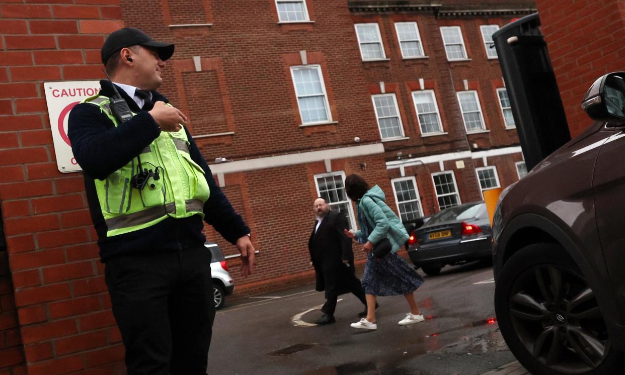 <span>A security guard stands at the entrance to a Jewish school in north London.</span><span>Photograph: Andy Rain/EPA</span>