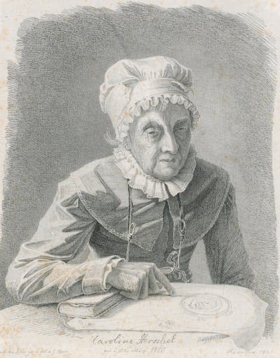 A black and white portrait of an older lady wearing a ruffled bonnet, pointing at a paper. She's holding a magnifying glass.