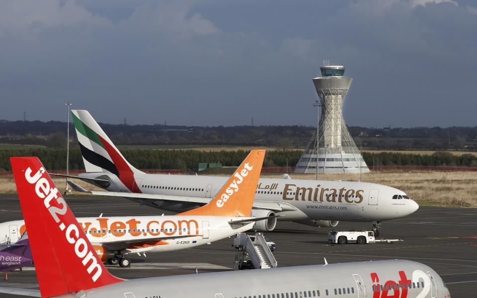 Planes parked in front of the control tower at Newcastle Airport - Getty