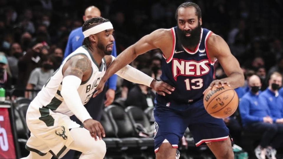 James Harden dribbles vs Bucks, navy jersey