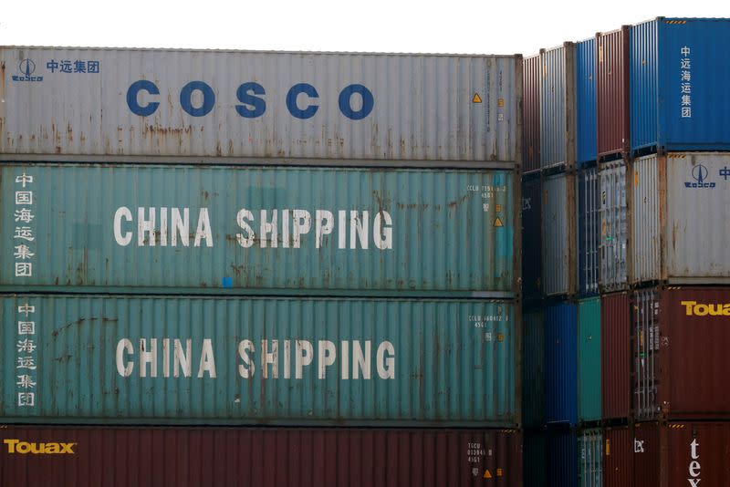 FILE PHOTO: Shipping containers of China Shipping and China Ocean Shipping Company are seen at the port of Antwerp