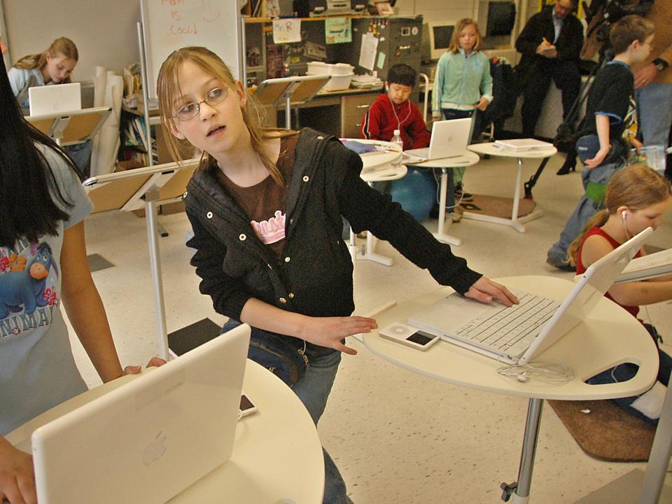 A student works at a standing desk in 2006