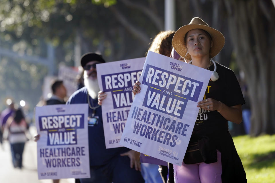 Kaiser Permanente workers picket Wednesday, Oct. 4, 2023, in Irvine, Calif. Some 75,000 Kaiser Permanente hospital employees who say understaffing is hurting patient care walked off the job Wednesday in five states and the District of Columbia, kicking off a major health care worker strike. (AP Photo/Ryan Sun)
