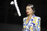 Model Gigi Hadid wears a creation as part of the Moschino Spring-Summer 2020 collection, unveiled during the fashion week, in Milan, Italy, Thursday, Sept. 19, 2019. (AP Photo/Luca Bruno)