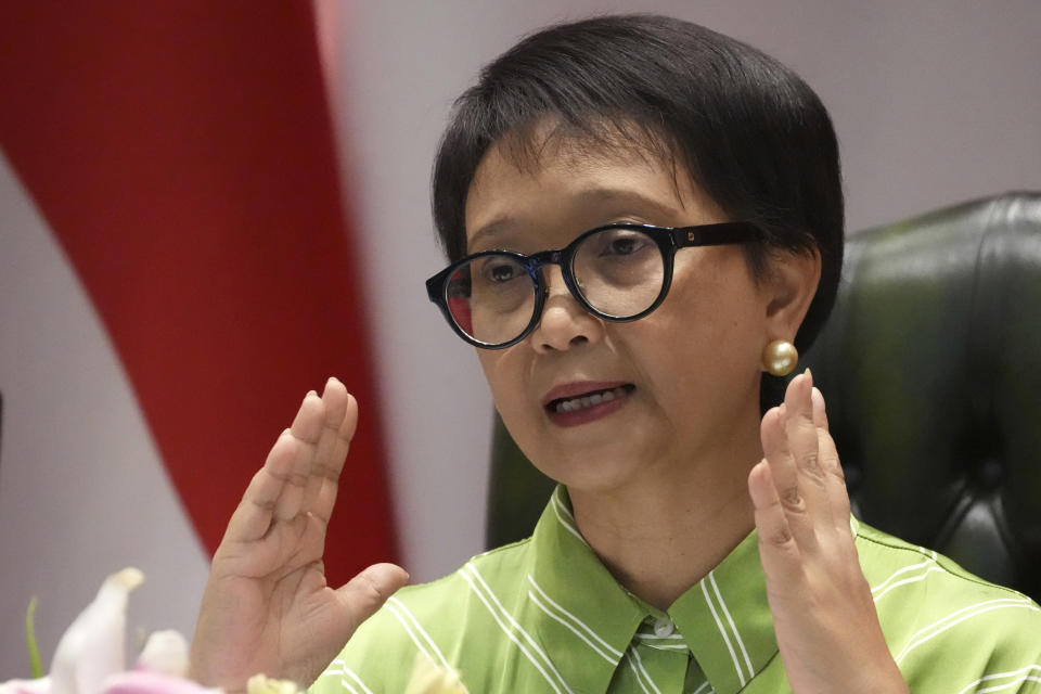 Indonesian Foreign Minister Retno Marsudi speaks during a news conference in Jakarta, Indonesia, Friday, May 5, 2023. Indonesian authorities said Friday they were trying to rescue dozens of its nationals who got trafficked to Myanmar's Kayin State to work as cyber scammers amid growing numbers of human trafficking victims in Southeast Asian region. (AP Photo/Achmad Ibrahim)