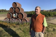 In this Oct. 4, 2019 photo, Eric Wente, chairman of Wente Vineyards, stands near vineyards at his family-run winery, which was founded by his great grandfather in 1883 in Livermore, Calif. Caught in the crossfire of President Donald Trump’s trade war with China, U.S. vineyards are struggling to sell Syrah in Shanghai and Chardonnay in Shenzhen. They risk losing their foothold in one of the world’s fastest-growing wine markets. Among the casualties is California's Wente Vineyards, that was among the first U.S. winemakers to export to China 25 years ago. (AP Photo/Terry Chea)