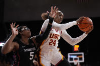Southern California guard Okako Adika, right, grabs a rebound away from Stanford forward Francesca Belibi during the first half of an NCAA college basketball game Sunday, Jan. 15, 2023, in Los Angeles. (AP Photo/Mark J. Terrill)