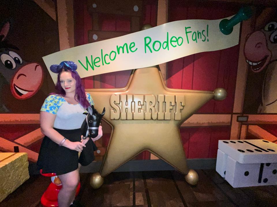 jenna posing in the photo area at roundup rodeo bbq in hollywood studios