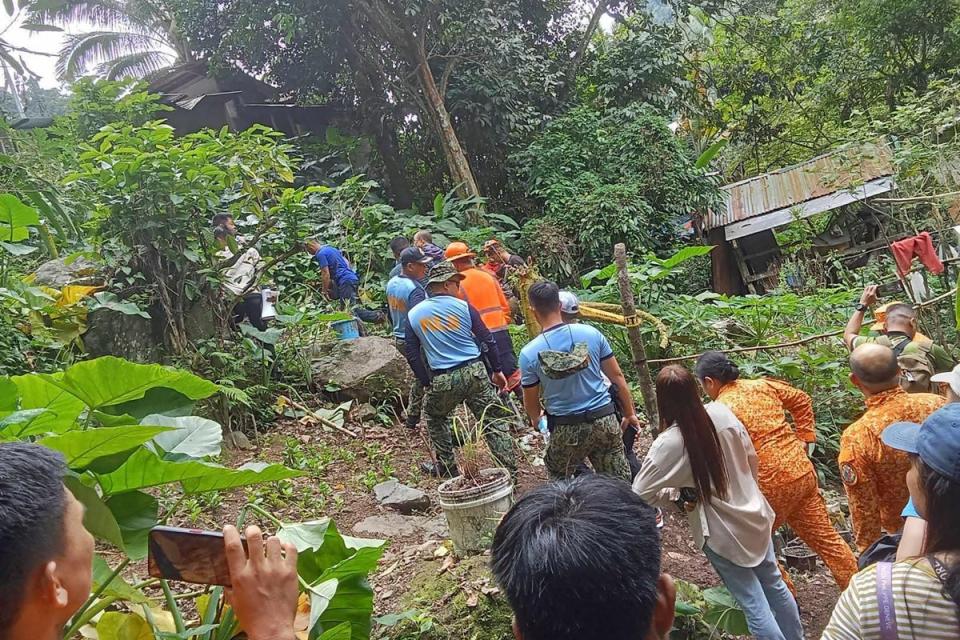 Responders conduct rescue operations at the site of a landslide (Office of the Provincial Fire Ma)