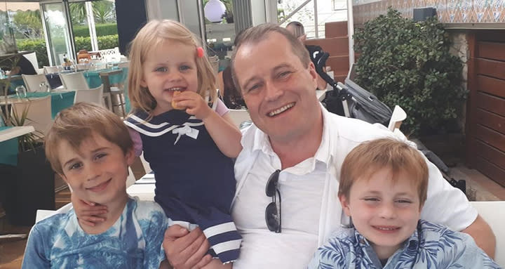 Conor, Darragh and Carla with their dad Andrew McGinley (Picture: PA)