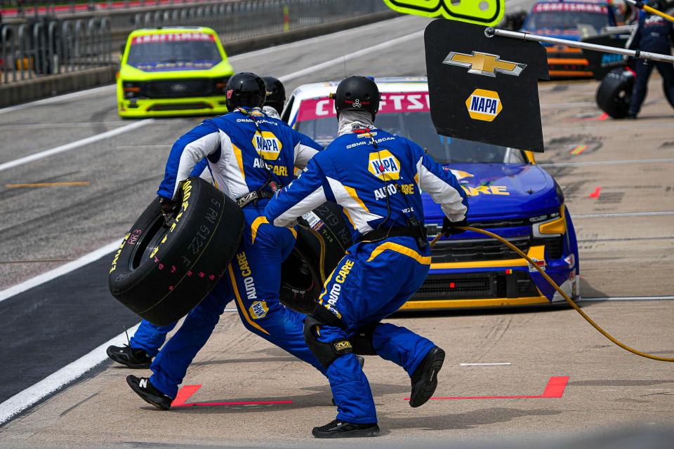 Christian Eckes' crew members hustle out for a pit stop during Saturday's NASCAR Craftsman Truck Series XPel 225 race at Circuit of the Americas. NASCAR's biggest race of the weekend will be Sunday: the EchoPark Automotive Grand Prix.