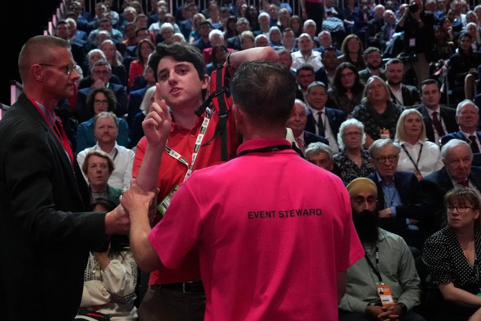 A protester shouts ‘does that include the children of Gaza?’ as Sir Keir Starmer delivers his keynote speech (Getty Images)