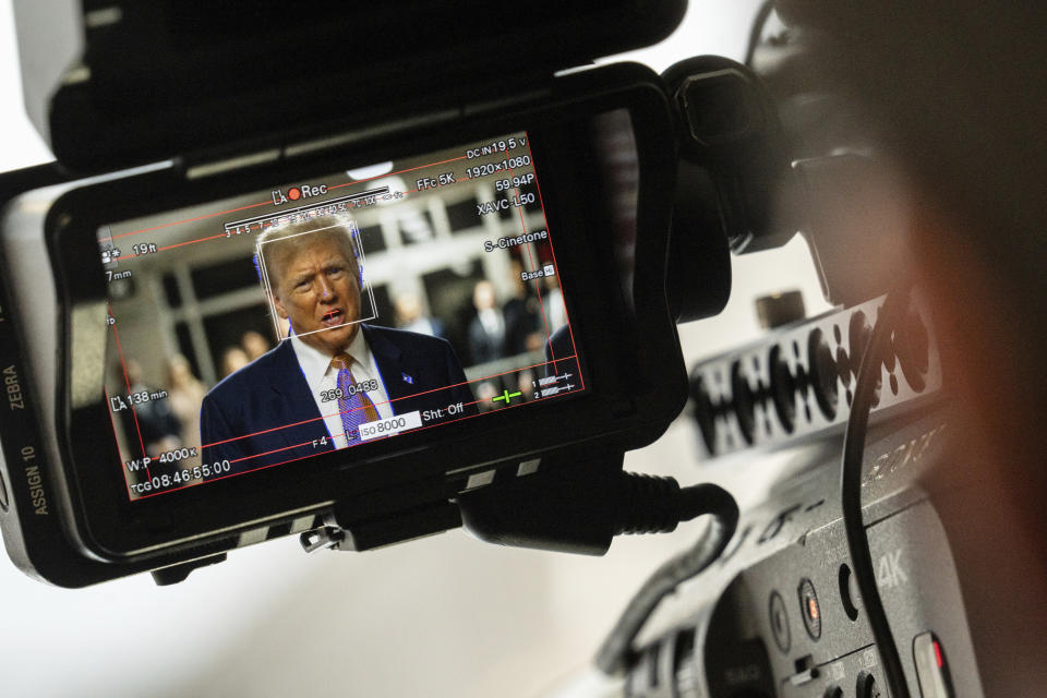 Former President Donald Trump, seen through a camera viewfinder, speaks to members of the media at Manhattan criminal court in New York, on Thursday, May 2, 2024. (Jeenah Moon/Pool Photo via AP)