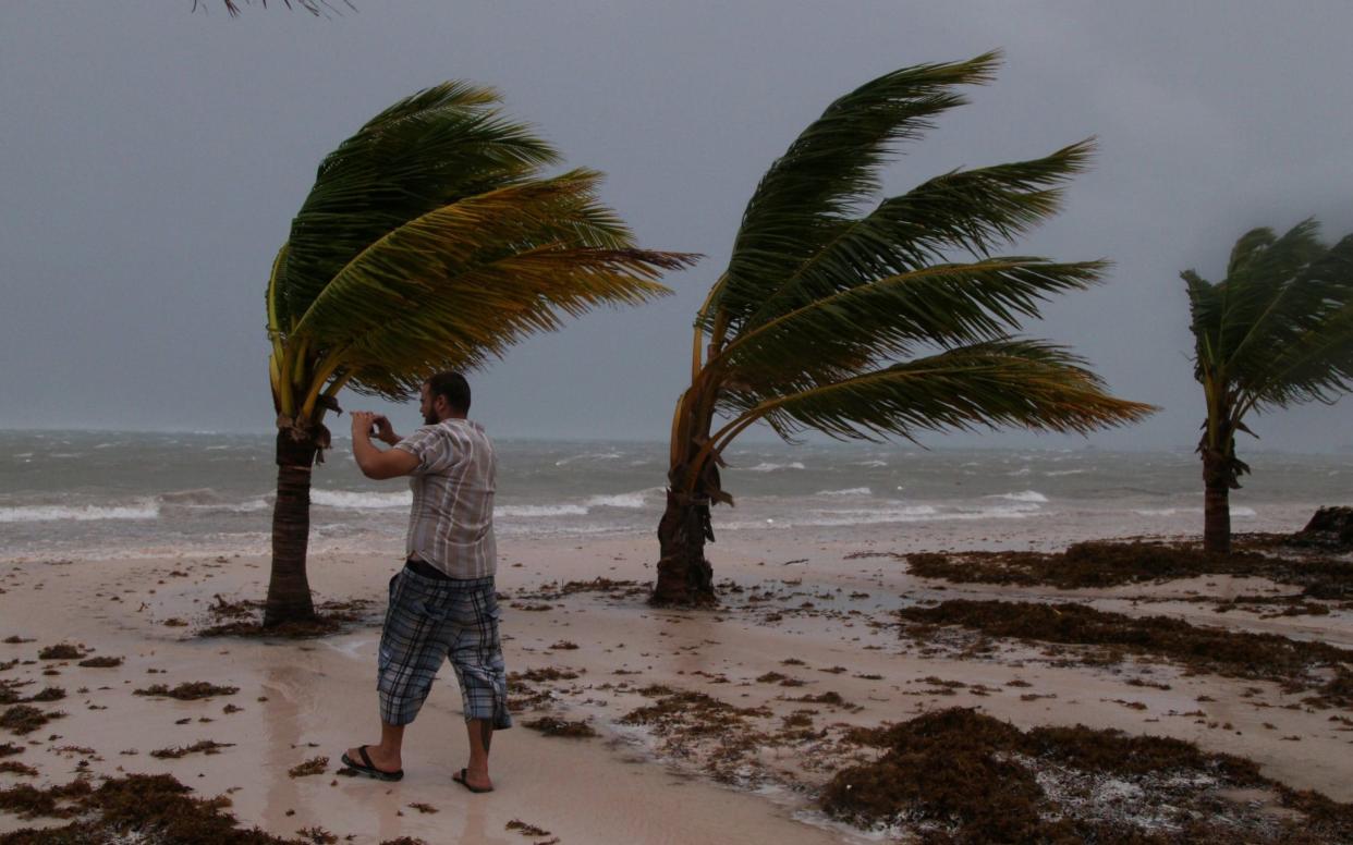 A man photographs the waves before the arrival of Hurricane Maria in Punta Cana - REUTERS