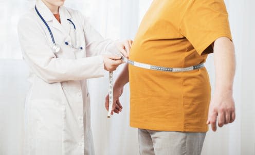 <span class="caption">Research shows that BRI may be better than BMI at predicting the health risks associated with different levels of body fat.</span> <span class="attribution"><a class="link " href="https://www.shutterstock.com/image-photo/doctor-measures-man-waist-1648282072" rel="nofollow noopener" target="_blank" data-ylk="slk:Maya Kruchankova/ Shutterstock;elm:context_link;itc:0;sec:content-canvas">Maya Kruchankova/ Shutterstock</a></span>