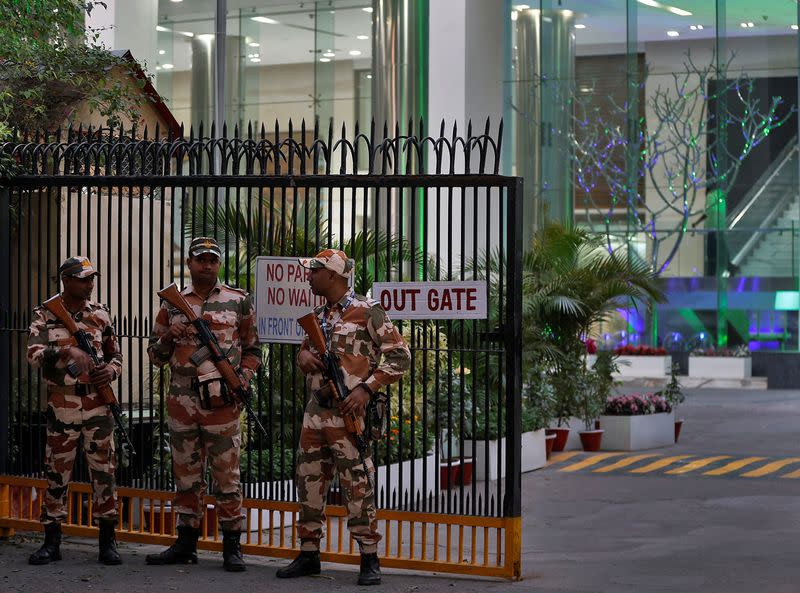 Members of the Indo-Tibetan Border Police stand guard outside a building housing BBC offices, in New Delhi